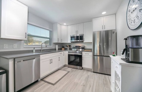 Mid Island House | Island Homes-on canal w/dock and heated pool/5 min walk to beach
