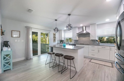 Mid Island House | Island Homes-on canal w/dock and heated pool/5 min walk to beach