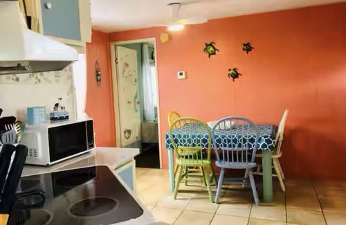 Flamingo Bay House | ISLAND TIME! DOCK! POOL! KAYAKS! BOAT To BEACH! PETS ALLOWED! The Purple House