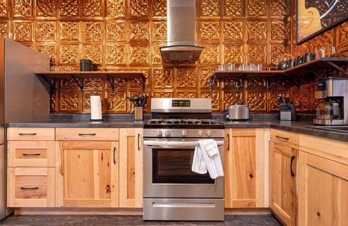 Interlochen House | Just outside Traverse City Hot Tub King Bed Fire Place Full Kitchen PET Friendly