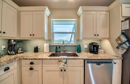 Beachview Country Club Estates House | Key West appeal & gorgeous Sanibel River views& bicycles -Villa Calypso Tides- Roelens Vacations