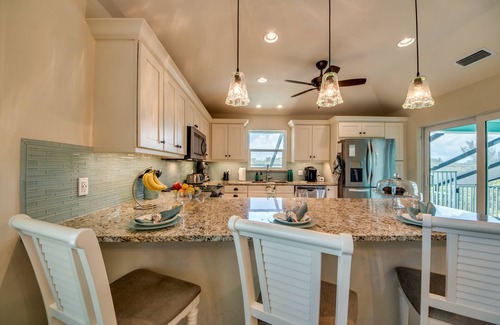Beachview Country Club Estates House | Key West appeal & gorgeous Sanibel River views& bicycles -Villa Calypso Tides- Roelens Vacations