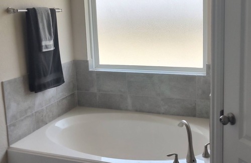 Santa Fe House | Kick back and relax in this calm, stylish space with a resort style feel.