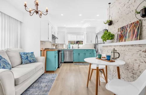 Lynn Valley House | King Bed with front door parking and private courtyard. Designed for living.