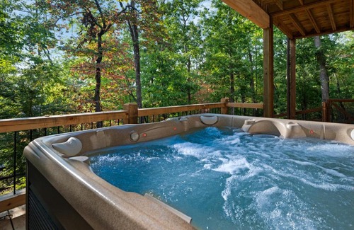 Mineral Bluff House | L Attitude Adjustment - Mineral Bluff GA - Enjoy king suites, a hot tub, a game room, a wood-burning fireplace, and a fenced yar