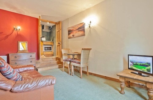 Coniston Apartment | Lake District village apartment with private riverside hot tub