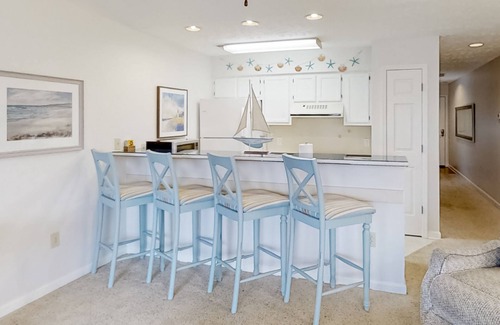 Little River Condo | Lake-view 3rd-floor condo with balcony, hot tub, outdoor pool, washer/dryer, AC