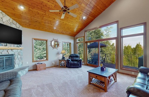 Land O Lakes Condo | Lake-view condo with dock, pool table, grill, deck, patio, wet bar, & streaming