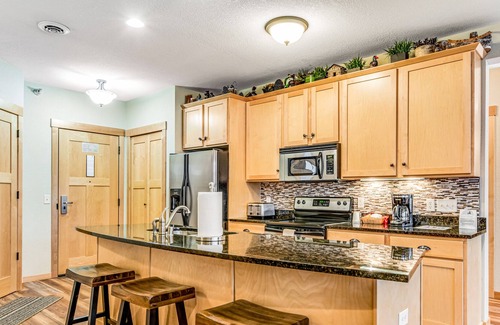 Three Lakes Condo | Lake view condo with 2 balconies, fireplace, pool, hot tubs, gym & sports courts