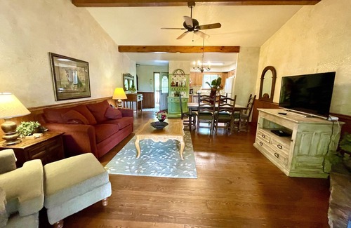 Mount Ida Cottage | Lake view two bedroom, two bath log-sided cottage with private hot tub overlooking Lake Ouachita. by RedAwning