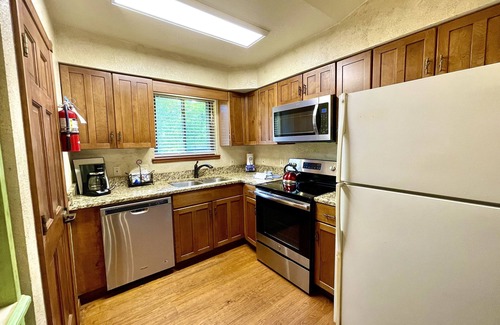 Mount Ida Cottage | Lake view two bedroom, two bath log-sided cottage with private hot tub overlooking Lake Ouachita. by RedAwning