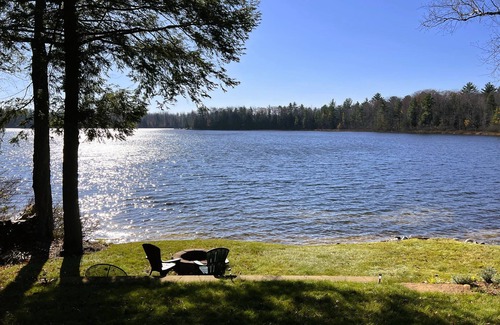 Traverse City House | Lakefront cabin on Bass Lake near Traverse City. Pets ok. Fire pit. Grill.