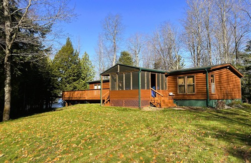 Traverse City House | Lakefront cabin on Bass Lake near Traverse City. Pets ok. Fire pit. Grill.