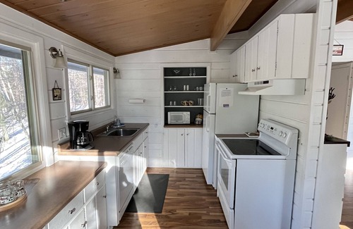 Three Lakes Cottage | Lakefront Cabin on Virgin Lake w/kayaks, lily pad, firepit, sandy swimming area