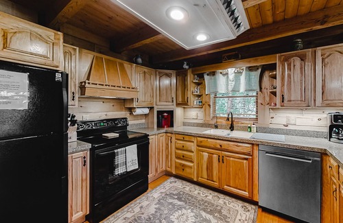 New Tazewell Cabin | Lakefront cabin with private covered dock, lovely deck, lake view & fireplace