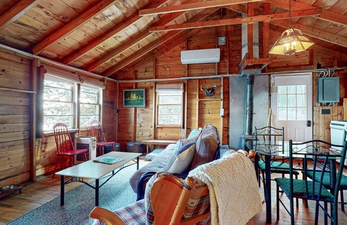 Otis Apartment | Lakefront cabin with deck, grill, screened porch, & firepit - dog-friendly