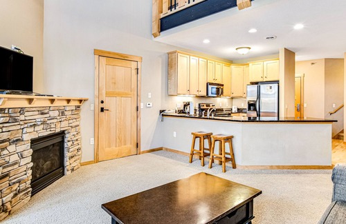 Three Lakes Condo | Lakefront condo with 2 balconies, loft, fireplace, W/D, indoor pool, & hot tubs