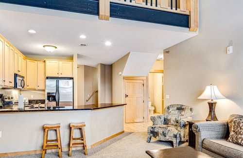 Three Lakes Condo | Lakefront condo with 2 balconies, loft, fireplace, W/D, indoor pool, & hot tubs
