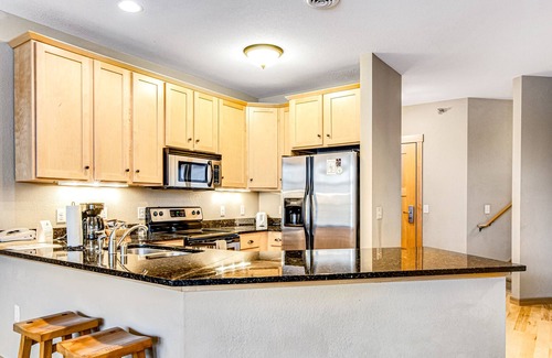 Three Lakes Condo | Lakefront condo with 2 balconies, loft, fireplace, W/D, indoor pool, & hot tubs