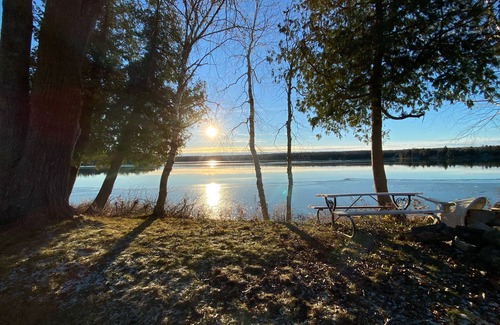 Baileys Harbor Cottage | Lakefront Cottage Retreat w/Private Dock, Paddle Boards, Fire Pit, Sunset Views
