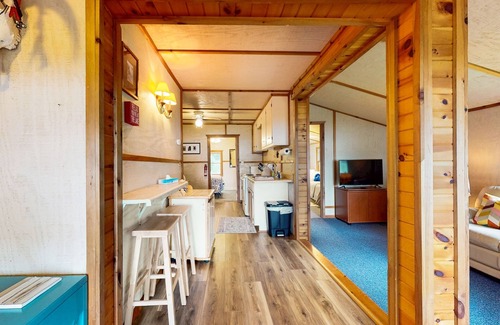 Eagle River House | Lakefront cottage w/a dock, shared furnished patio, firepit, & a paddleboat