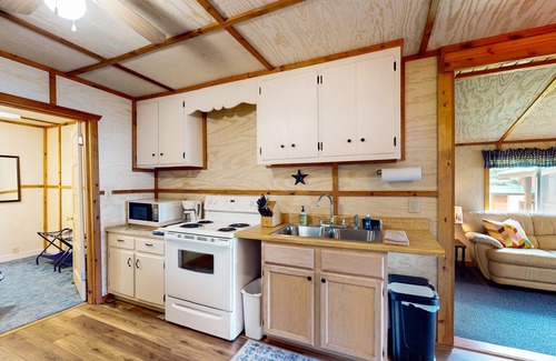 Eagle River House | Lakefront cottage w/a dock, shared furnished patio, firepit, & a paddleboat