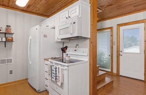 Tuscumbia Cottage | Lakefront Cottage with Boat Slip and Paddleboat