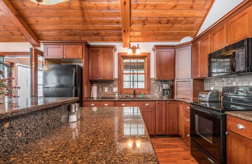 Conover House | Lakefront dog-friendly home with firepit, play set, dock, & beach access