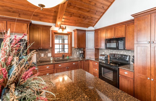 Conover House | Lakefront dog-friendly home with firepit, play set, dock, & beach access