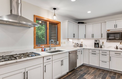 Lac du Flambeau House | Lakefront estate with 3-story chalet & guest house - hot tub, game room, and gym