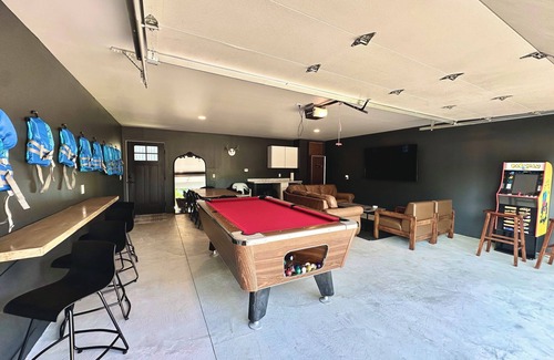 Prudenville House | Lakefront Home: Hot Tub, Paddle Boards, Game Room