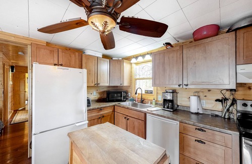 Lac du Flambeau House | Lakefront home with dock, swimming area, & wood stove - sunset views