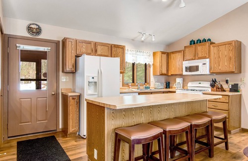 Lac du Flambeau House | Lakefront home with firepit, screened porch, WiFi, central AC, and kayaks