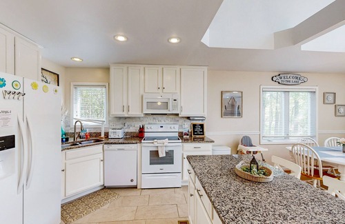 Bumpass House | Lakefront home with brand-new hot tub, dock, kayaks, SUP, game room & firepit