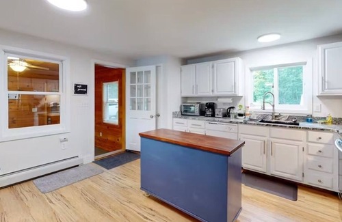 Alton Bay House | Lakefront home with deck, game room, washer/dryer, grill, dock, & views