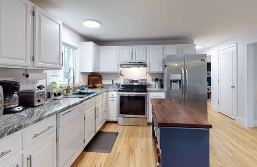 Alton Bay House | Lakefront home with deck, game room, washer/dryer, grill, dock, & views