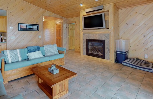Otis House | Lakefront home with dock, kayak, firepit, screened porch, fireplace, & W/D