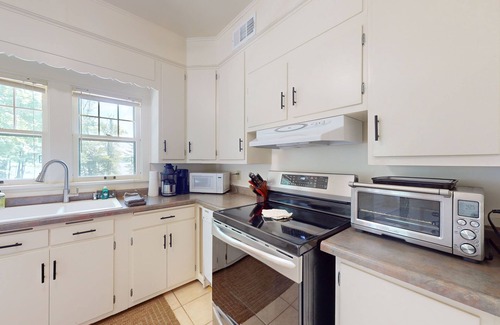 Phelps House | Lakefront home with large patio, docks, gas grill, fire pit, & WIFI