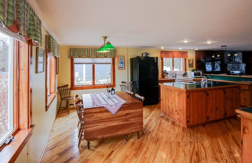 South Hero House | Lakefront Home with Patio Over the Lake, Private Dock, & Stunning Sunset Views