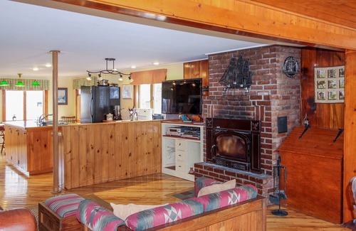 South Hero House | Lakefront Home with Patio Over the Lake, Private Dock, & Stunning Sunset Views