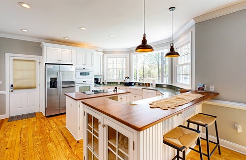 Mineral House | Lakefront home with private dock, kayaks, beach, badminton, firepit, & deck