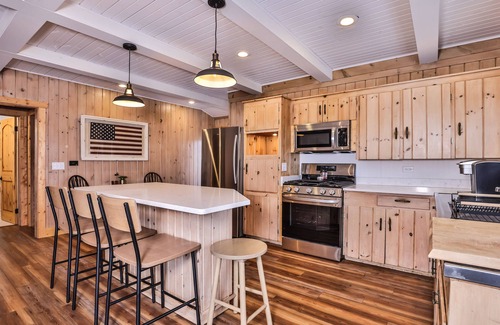 Sayner House | Lakefront home with private dock, deck, fireplace, firepit, canoe & paddleboat