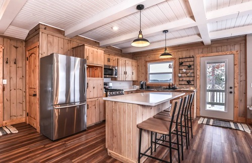 Sayner House | Lakefront home with private dock, deck, fireplace, firepit, canoe & paddleboat