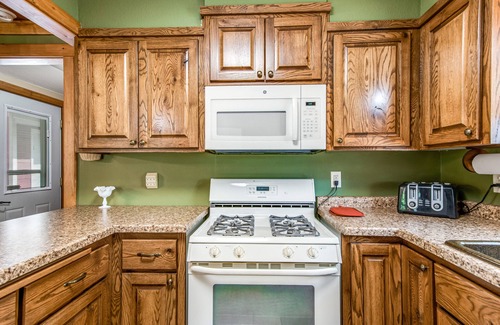 Arbor Vitae House | Lakefront home with dock, fireplace, deck, firepits & fast WiFi - dog-friendly