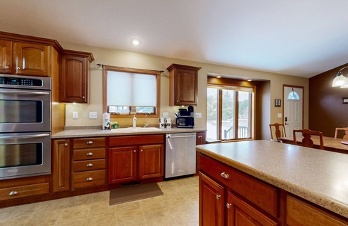 Friendship House | Lakefront home with grill, firepit, pool table, jetted tub