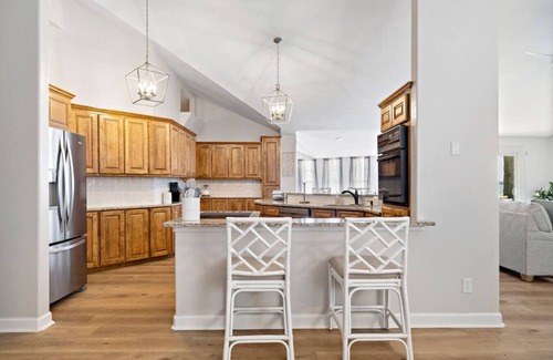 West Livingston House | Lakefront home with Pool, Game Room and Dock