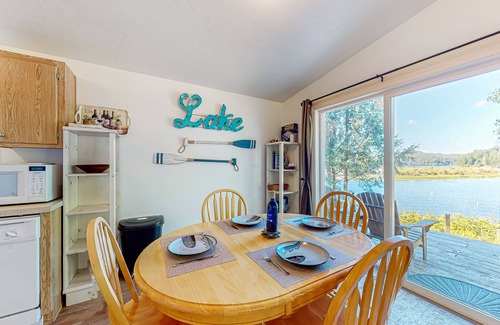 Lakeside House | Lakefront home with water/dune access, deck, grill, firepit, dock, & W/D