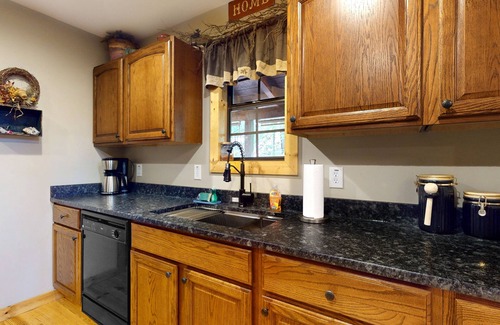Blairsville Cabin | Lakefront house with dock, kayaks, grill, fireplaces, pool table, hot tub, & W/D