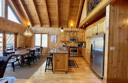 Six Mile House | Lakefront house with multiple outdoor areas, fire pit, dock and two kayaks