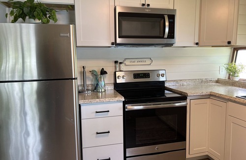 Traverse City Cottage | LAKEFRONT RETREAT WITH KAYAK AND PADDLE BOARDS, LONG LAKE, TRAVERSE CITY